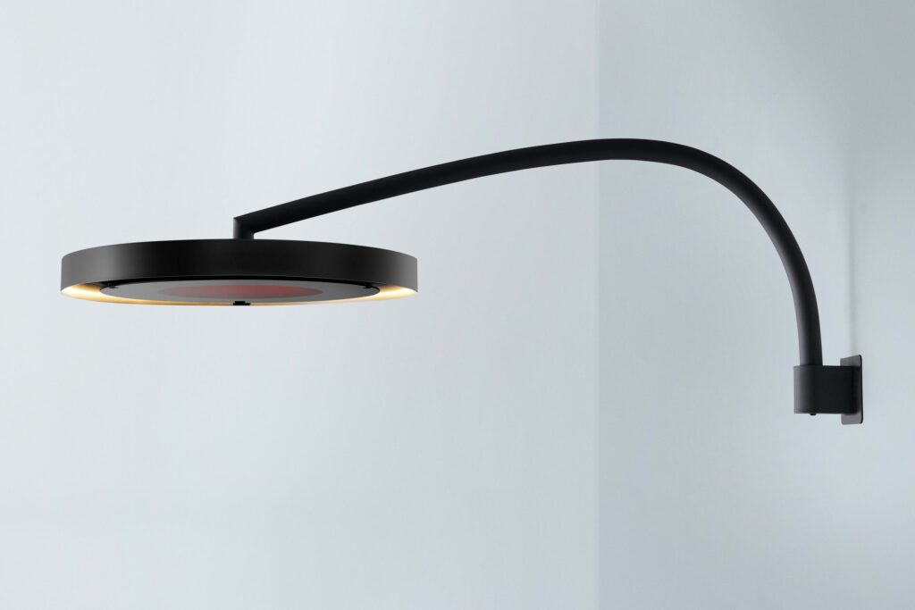 Wall mounted curved electric heater